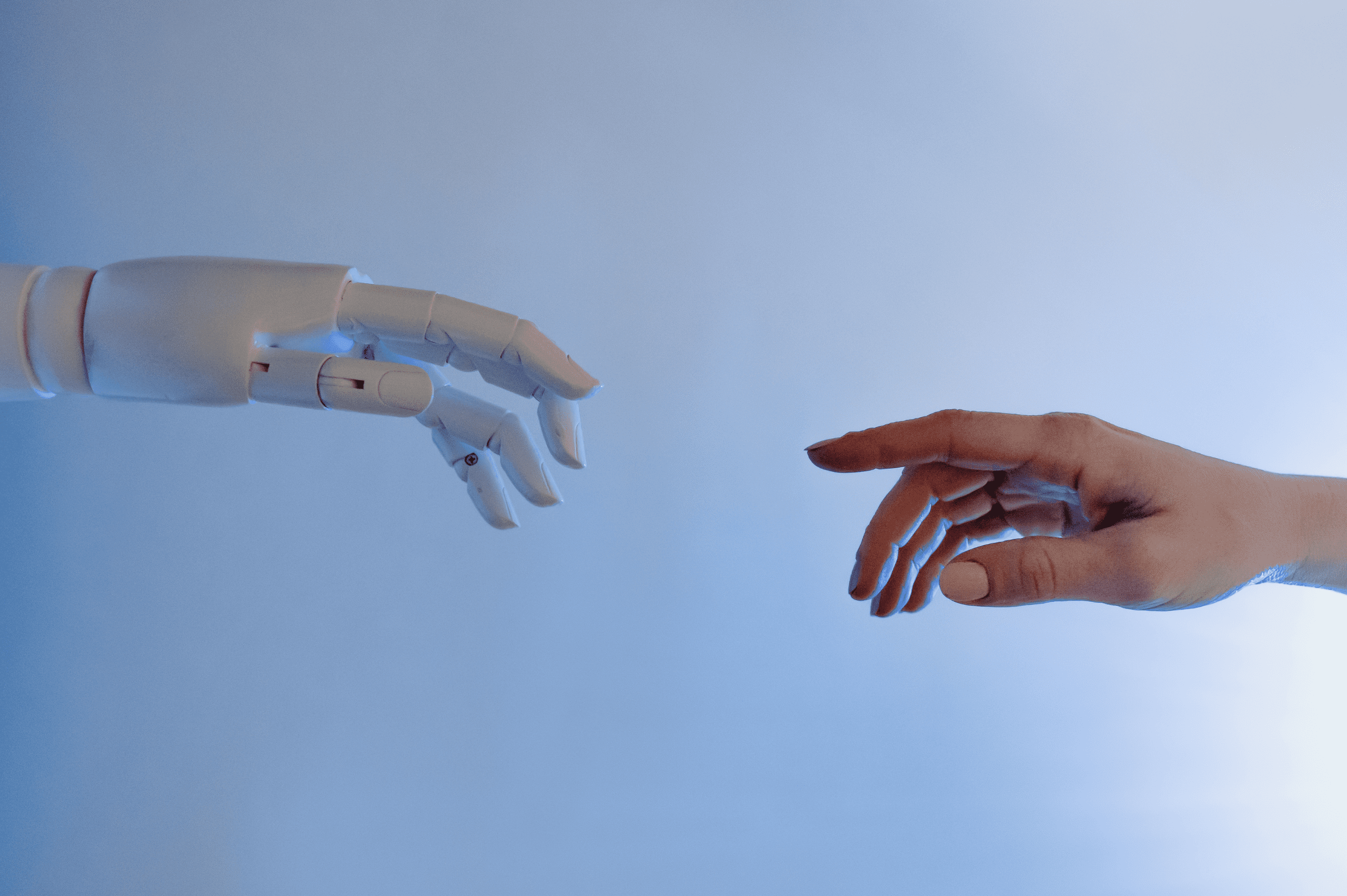 Person reaching out to a robot or artificial intelligence (AI)