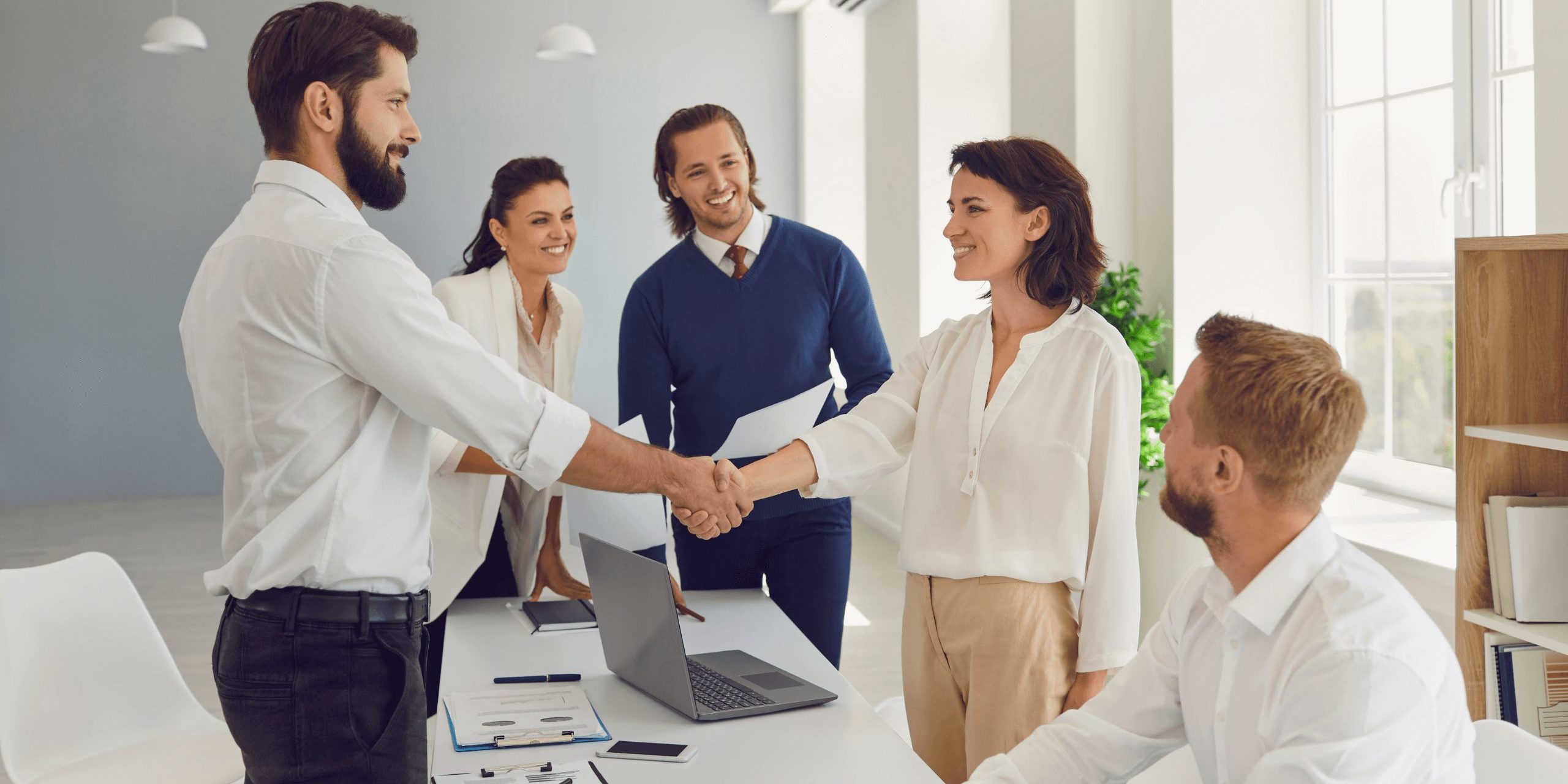Business people shaking hands confirming a business deal in a negotiation meeting
